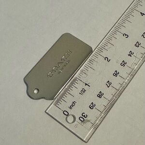 Coach Metallic Silver Tag